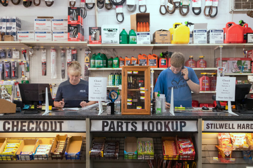 Employees working the counter at Stilwell Hardware Inc. The owners said reliable internet access is important for many of their business functions.
